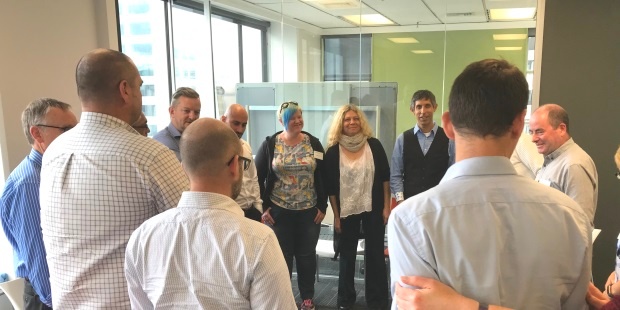 Michael Sahota and Audree Tara lead the 'check out' stand-up circle at the end of the Agile leadership and culture overview with Equinox IT