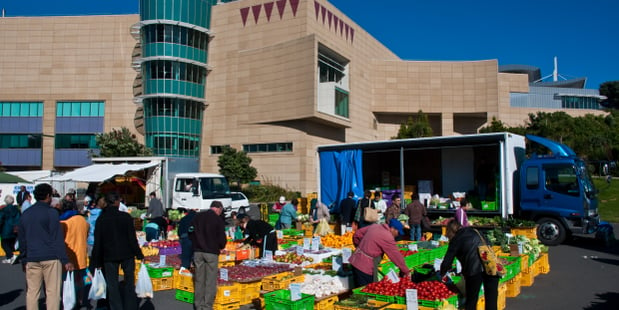 Wellington market with customers shopping for fresh fruit and veges goods